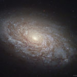 NGC 4414: المجرة اللولبية المتلبدة